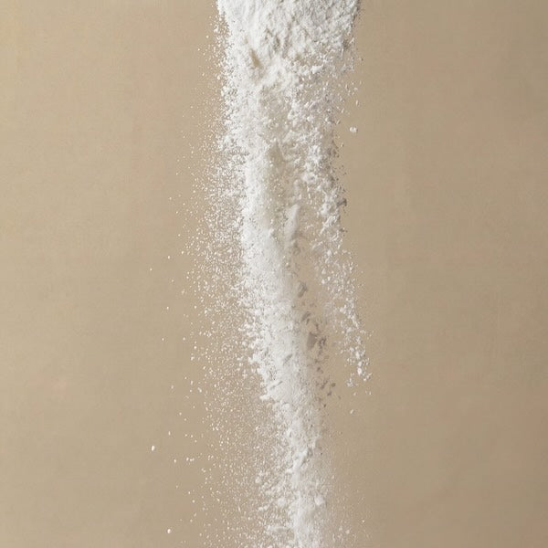 White powder on a beige background