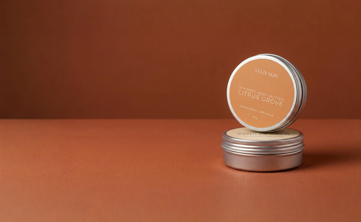 Two metallic tins with a brown background