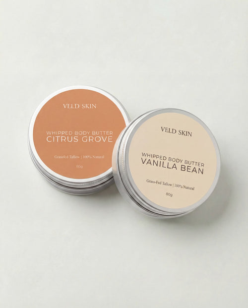 Two tins of Veld Skin whipped body butter on a light background
